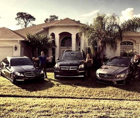 Mercedes familyOn mansion front lawn